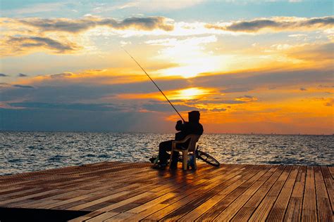 Free man fishing Stock Photos & Pictures .